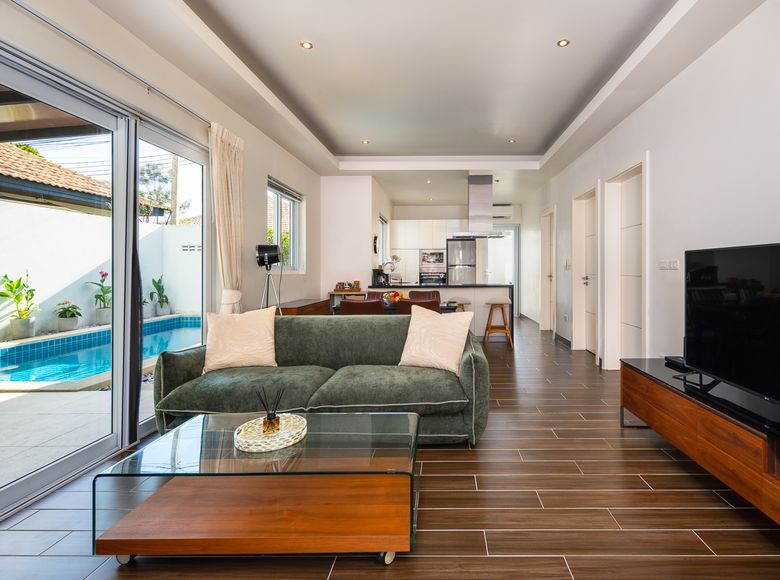Bright open living room looking out to the pool